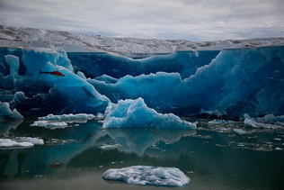 Drained glacier dammed meltwater lake reveals walls of bue ice. Near Helheim Glacier, Southeast Greenland © Henrik Egede Lassen/Alpha Film